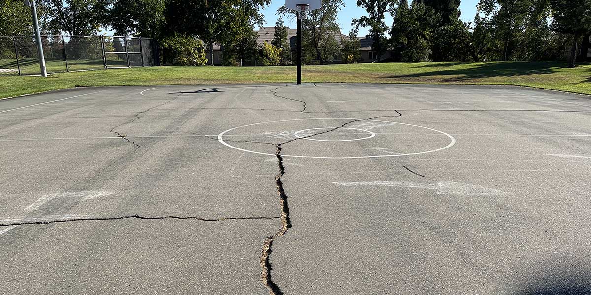 Asphalt issues on basketball court at city park
